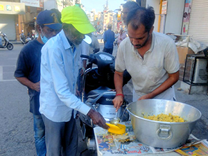 Street dwellers receive meals and dignity from NGO for food donation in Pune