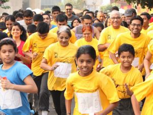 Differently-abled participants in Breast Cancer Awareness Marathon promoted by sports charity organizations