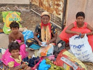 Women and children below the poverty line receive support kits from MMPC’s poverty eradication initiative