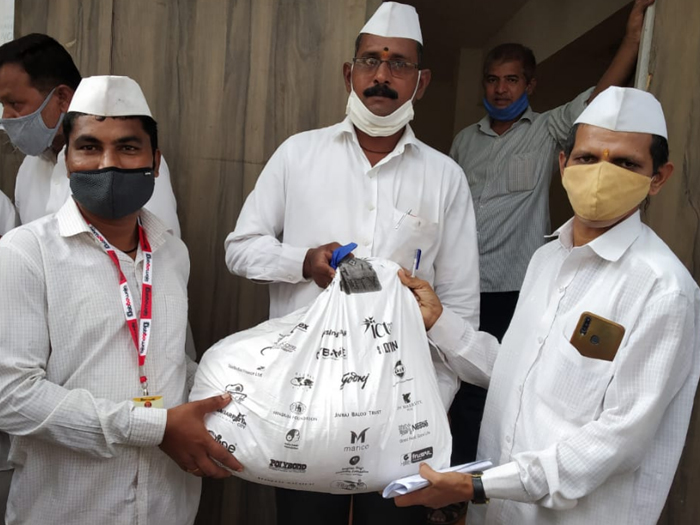Give with Dignity Kits with groceries and hygiene essentials distributed to Mumbai Dabbawalas by Top NGO in India
