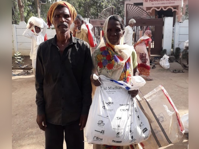 Farm workers receive Give with Dignity Kits during charity event by NGO for poverty in Pune